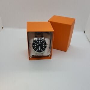 Tudor Black and Silver Watch with Sporty Design
